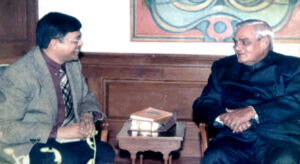 Professor Rajiv K. Saxena presenting the Geeta Kavya Madhuri to the Prime Minister Atal Bihari Vajpeyee (Year 2002)