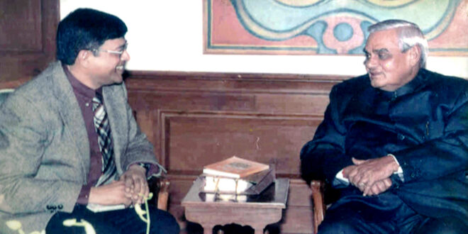 Professor Rajiv K. Saxena presenting the Geeta Kavya Madhuri to the Prime Minister Atal Bihari Vajpeyee (Year 2002)
